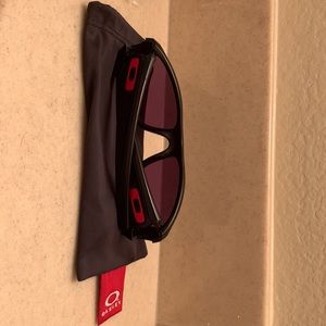 Custom Oakley sunglasses. Hardly worn. Great sport glasses. Black w/Red O symbol